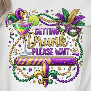 May include: White t-shirt with a colorful Mardi Gras design. The graphic includes a cocktail, mask, and the text "Getting Drunk Please Wait." The design features gold, green, purple, and yellow accents, with a fleur-de-lis symbol.