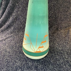 May include: A set of three ceramic mugs with a speckled, matte finish. The mugs are in shades of cream, light gray, and dark gray. Each mug has a simple, minimalist design, perfect for coffee or tea.