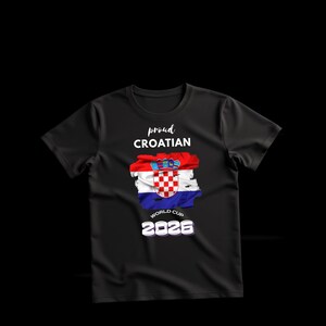 May include: Black t-shirt with the text "proud CROATIAN" above a graphic of the Croatian flag. Below the flag is "WORLD CUP 2026" in white text. The shirt has a crew neck and short sleeves.