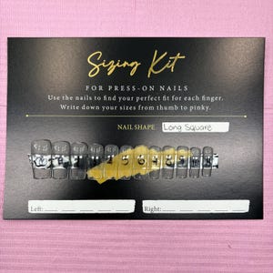May include: A black sizing kit for press-on nails, with the text "Sizing Kit" in gold script. The kit includes clear, long square nail samples numbered 0-10. Instructions are provided to measure nail sizes for each finger.