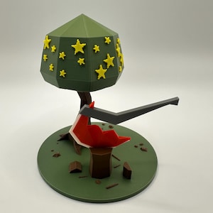 May include: A 3D-printed model of a stylized tree with yellow star-shaped accents on a green, geometric canopy. The tree sits on a green circular base with a red, angular object and a dark gray, angled element extending from it.