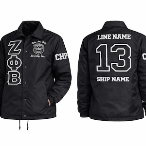 May include: Black coach jacket with white lettering and numbers. The front features the Greek letters ZΦB and the text "Zeta Phi Beta Sorority, Inc." The back displays the number 13 and space for a line and ship name.