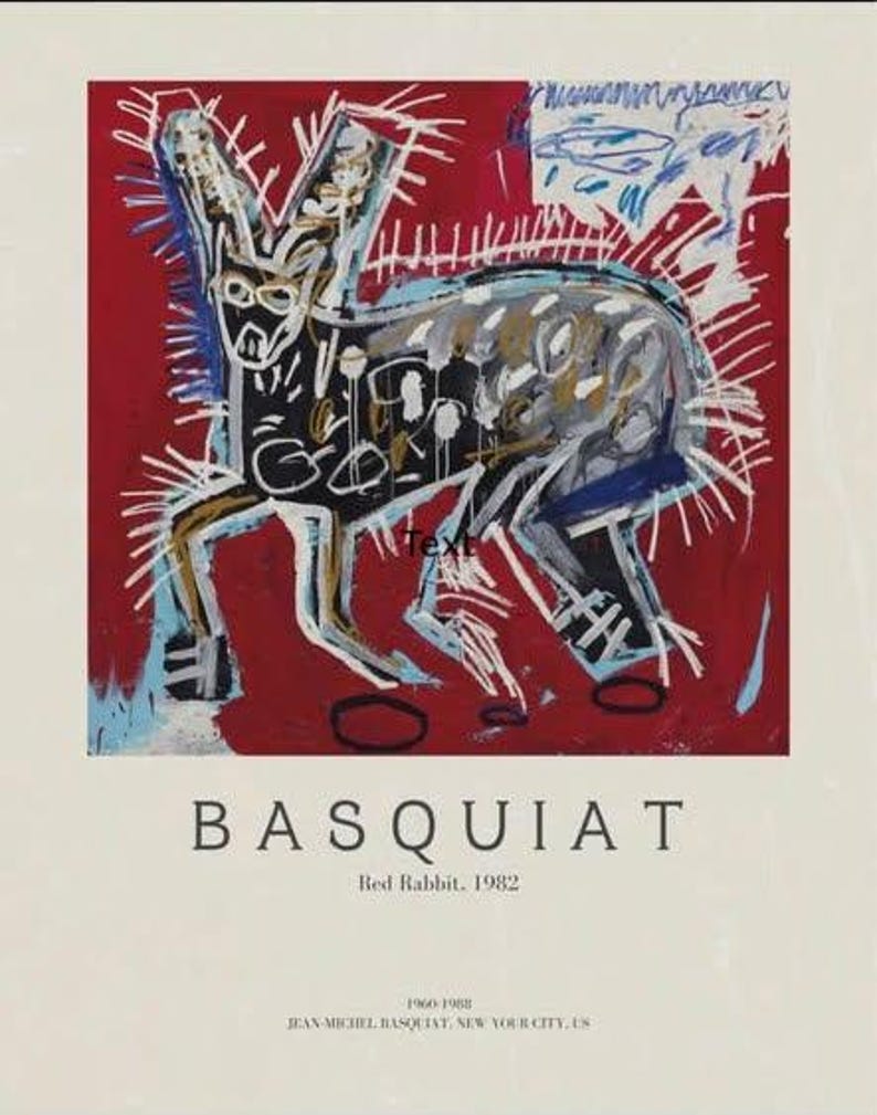 May include: A framed art print of Basquiat's "Red Rabbit, 1982." The painting shows a rabbit-like creature in black, white, and blue on a red backdrop. The artist's name and dates are printed below the artwork.