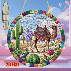 May include: A round stained glass window featuring a camel in a desert landscape with cacti and mountains. The window has a colorful border and is suspended by a gold string. The thickness is 0.07 inches.