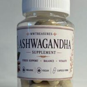 May include: A clear glass bottle with a white lid and a label that reads "Ashwagandha Supplement." The label also includes the text "Stress Support, Balance, Vitality," and "Organic, Vegan, 8 Capsule Herb."