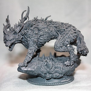 May include: A gray figurine of a wolf-like creature with intricate details. The sculpture features a wolf with a snarling expression, adorned with leaves and vines. The wolf is posed on a rocky base, showcasing a fantasy theme.