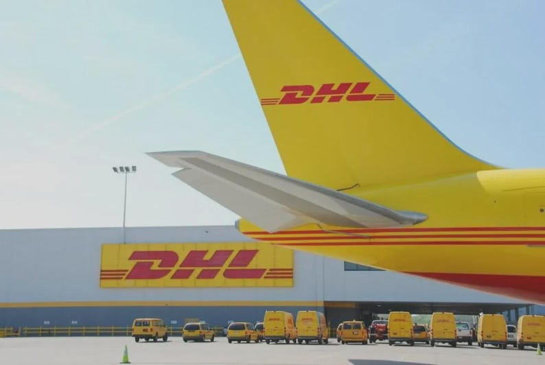 May include: A yellow DHL airplane tail with the DHL logo and a row of yellow DHL vans parked in front of a building with the DHL logo. The sky is blue.