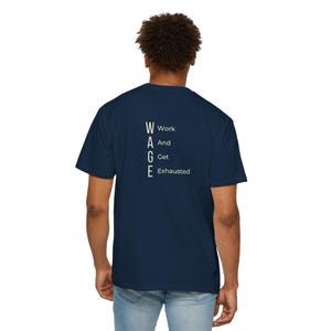 May include: Navy blue t-shirt with the word "WAGE" in white, vertically aligned, with the words "Work And Get Exhausted" to the right. The shirt is made of a soft material.