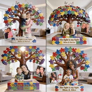 Puede incluir: Una escultura de árbol de cerámica con un dosel y una base de rompecabezas. El tronco del árbol sostiene una figura de madre e hijo. La base dice "His fight is my fight Mom & Hector" e incluye una foto. Mariposas están posadas encima.