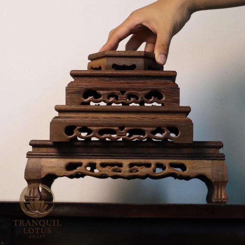 Hand stacking carved dark wood display stands showing all sizes: small Hexagon 4.7 inch, Square 6.3 inch, Square High 7.9 inch, and large Rectangle 11.8 inch base. Solid Sindora wood altar risers.