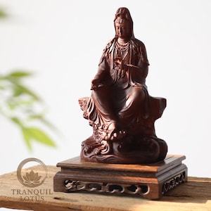 Guan Yin Bodhisattva statue elevated on a 7.9 inch (20cm) Square High wooden stand. Carved dark wood pedestal providing stability for large spiritual statues or heavy vases.