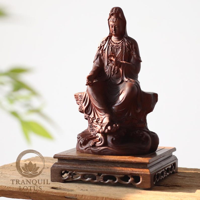 Guan Yin Bodhisattva statue elevated on a 7.9 inch (20cm) Square High wooden stand. Carved dark wood pedestal providing stability for large spiritual statues or heavy vases.