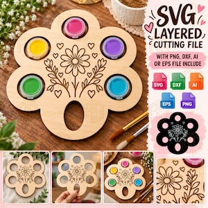 May include: A light-colored wooden paint palette shaped like a flower with six circular cutouts holding small paint pots in pink, yellow, purple, green, and blue. The center features a laser-engraved floral design with hearts and stems.