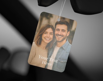 May include: A rectangular air freshener with a photo of a smiling couple. The air freshener is hanging by a string. The text "Your Text Here" is printed on the air freshener.
