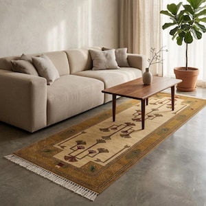Hand knotted tree runner rug in Oushak style featuring ivory base with rust and olive floral tree pattern, long hallway wool rug with symmetrical botanical design and decorative border, handmade vintage style runner rug with fringe edges, perfect for entryway hallway decor, soft natural wool texture visible, premium artisan craftsmanship, elegant neutral home decor piece.
