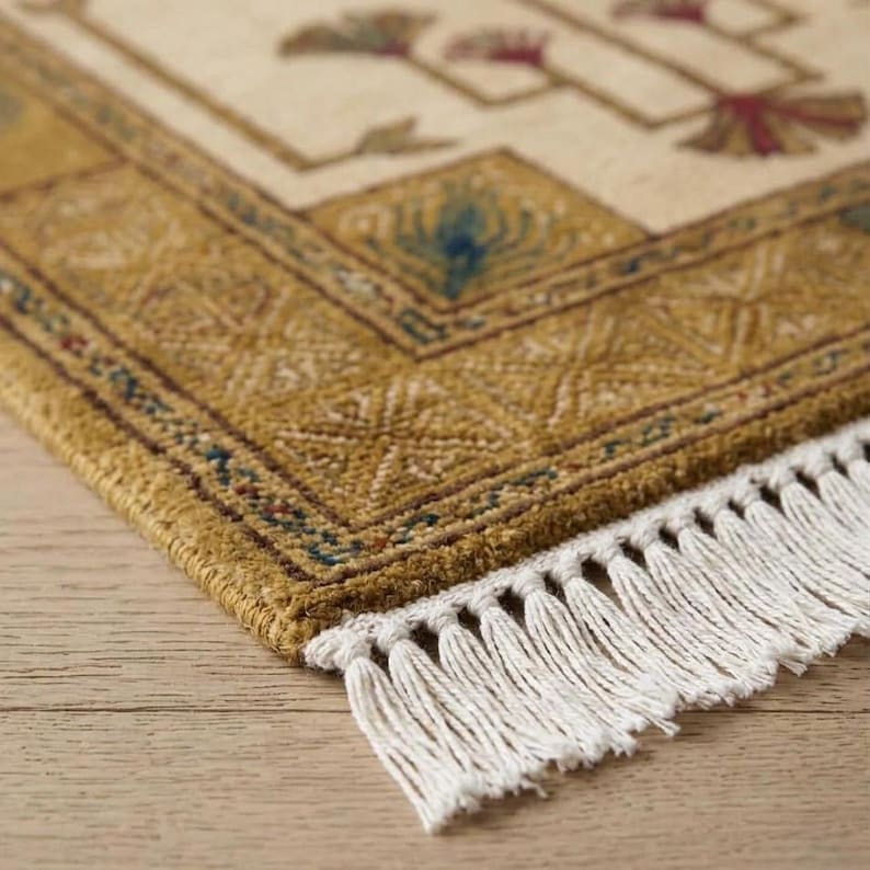Hand knotted tree runner rug in Oushak style featuring ivory base with rust and olive floral tree pattern, long hallway wool rug with symmetrical botanical design and decorative border, handmade vintage style runner rug with fringe edges, perfect for entryway hallway decor, soft natural wool texture visible, premium artisan craftsmanship, elegant neutral home decor piece.