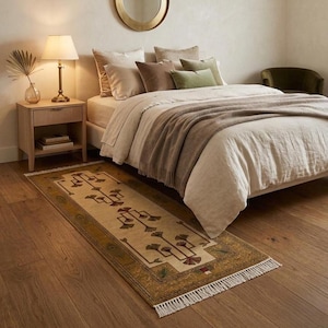 Hand knotted tree runner rug in Oushak style featuring ivory base with rust and olive floral tree pattern, long hallway wool rug with symmetrical botanical design and decorative border, handmade vintage style runner rug with fringe edges, perfect for entryway hallway decor, soft natural wool texture visible, premium artisan craftsmanship, elegant neutral home decor piece.