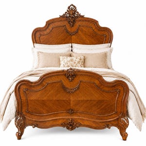 May include: A wooden bed frame with a high headboard and footboard featuring intricate carved scrollwork details. The bed is dressed with white pillows, beige accent pillows, and a light beige throw blanket draped over the mattress.