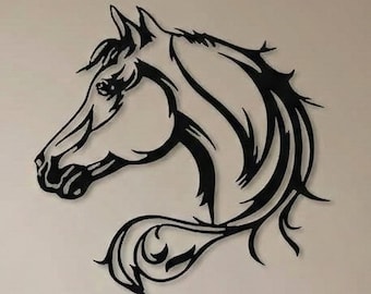 May include: Black metal horse head wall art. The artwork depicts a stylized horse head with flowing mane and tail. The horse head is mounted on a neutral-colored wall above a beige sofa with pillows.