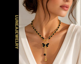 Collar con colgante de mariposa negra, cadena dorada y borla para mujer.