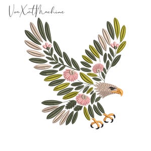 May include: An embroidered design of an eagle in flight, composed of leaves and flowers. The eagle's wings are formed by olive green and beige leaves, with pink flowers interspersed. The eagle's head is detailed with tan and brown thread, and the beak is yellow.