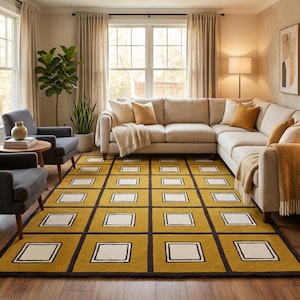 May include: A living room featuring a mustard yellow rug with a grid pattern of black borders and white squares. The room includes a beige sectional sofa, two gray armchairs, and large windows with beige curtains. Decorative pillows and throws add warmth.
