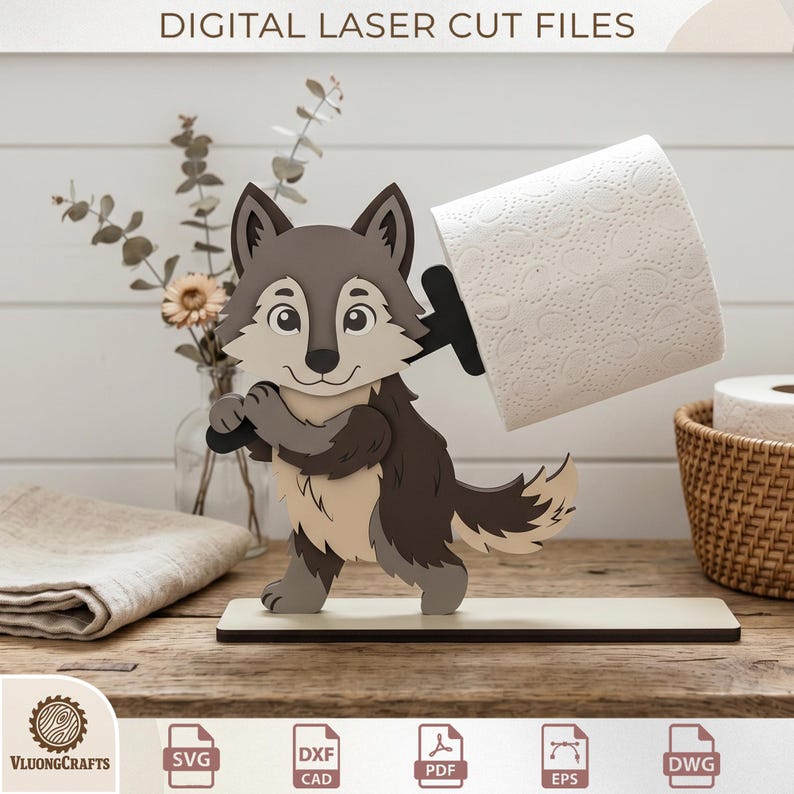 May include: A wooden wolf-shaped toilet paper holder. The wolf is gray, brown, and beige, holding a black bar that supports a roll of white toilet paper. The base is rectangular and beige. The text "DIGITAL LASER CUT FILES" is at the top.