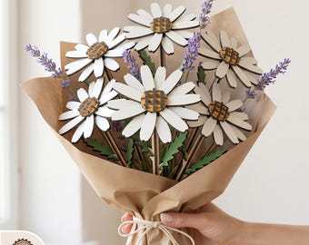 May include: A bouquet of laser-cut wooden daisies with white petals and brown centers, accented with lavender sprigs. The flowers are wrapped in brown paper and tied with twine. The text "DIGITAL LASER CUT FILES" is at the top.