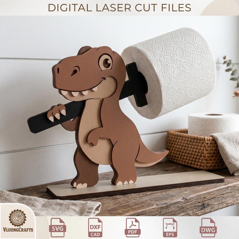 May include: A wooden dinosaur-shaped toilet paper holder. The dinosaur is brown and tan, holding a black bar that supports a roll of white toilet paper. The base is a light tan color. The text "DIGITAL LASER CUT FILES" is at the top.