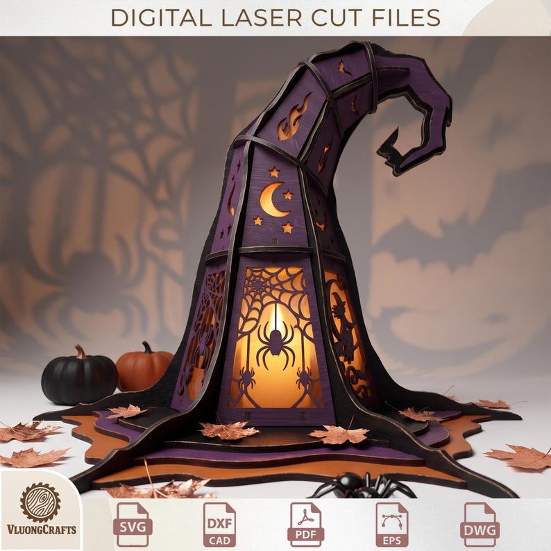 May include: A purple and black laser-cut wooden witch hat lantern featuring cutouts of spiders, webs, moons, stars, and a witch silhouette. The structure is illuminated from within, casting shadows. Text at the top reads DIGITAL LASER CUT FILES.