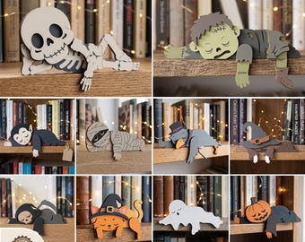Könnte beinhalten: Digitale Lasercut-Dateien für zehn Halloween-Regalfiguren, darunter Skelett, Zombie, Vampir, Mumie, Krähe, Hexenhut, Sensenmann, Katze, Geist und Kürbis. Die Dateien sind in den Formaten SVG, DXF, PDF, EPS und DWG für Bastelprojekte verfügbar.