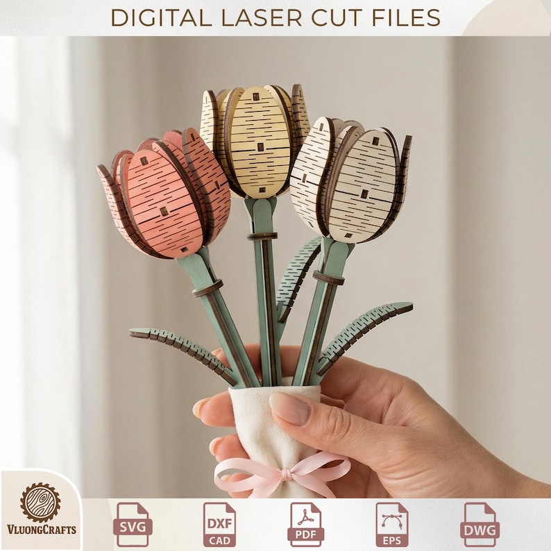 May include: A bouquet of laser-cut wooden tulips in a white vase tied with a pink ribbon. The tulips are in shades of pink, cream, and natural wood tones, with green stems and leaves. The text "DIGITAL LASER CUT FILES" is at the top.
