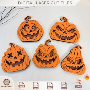 May include: Five layered orange wooden pumpkin decorations with various carved facial expressions including wide grins, jagged teeth, and X-shaped eyes. The text DIGITAL LASER CUT FILES is at the top, and file format icons SVG, DXF, PDF, EPS, and DWG are at the bottom.