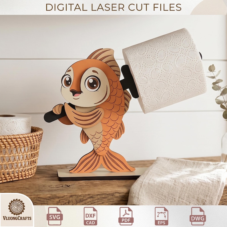 May include: A wooden fish-shaped toilet paper holder. The fish is orange and tan with large eyes and holds a black bar supporting a roll of white toilet paper. The base is a light brown rectangle. The text "DIGITAL LASER CUT FILES" is at the top.