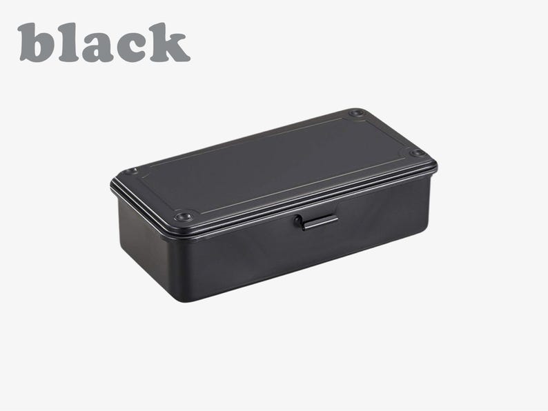 May include: A black rectangular toolbox with a handle and a hinged lid. The word "black" is printed in gray above the toolbox. The toolbox has a matte finish and is likely made of metal.