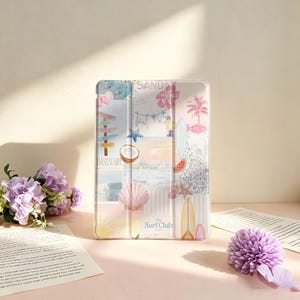 May include: A rectangular tablet case featuring a collage of beach-themed illustrations including a coconut, seashell, surfboard, palm tree, and the text The Surf Club. The design incorporates soft pastel colors like pink, blue, and yellow on a white background.