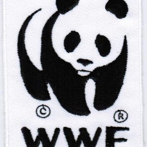 May include: A white rectangular patch featuring the WWF logo. The logo depicts a black and white panda bear. Below the panda is the black text "WWF". The patch has a copyright and registered trademark symbol.