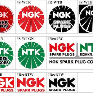 May include: A collection of logos for NGK spark plugs and NTK oxygen sensors. The logos feature the brand names in various colors, including red, white, black, and green, with the words "SPARK PLUGS" and "OXYGEN SENSORS".