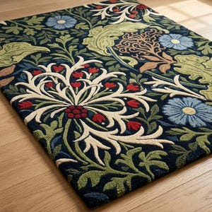 May include: A rectangular area rug featuring a dark navy blue background with a dense, repeating botanical pattern. The design includes large, cream-coloured stylised floral motifs, light blue daisy-like flowers, and various green leaves.