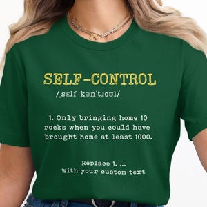 Puede incluir: Camiseta verde oscuro con el texto amarillo "SELF-CONTROL", una pronunciación fonética y una definición humorística. El diseño incluye la frase "Replace 1. ... With your custom text."