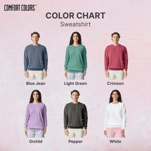 May include: A colour chart of Comfort Colors sweatshirts in six shades: Blue Jean, Light Green, Crimson, Orchid, Pepper, and White. Each colour is shown on a person wearing the sweatshirt. The Comfort Colors logo is in the top left corner.