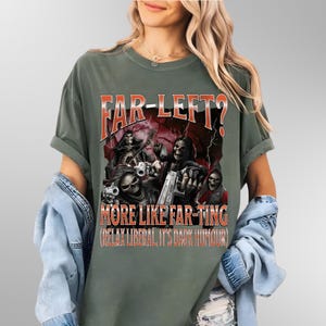 May include: Dark green t-shirt featuring the text "FAR-LEFT?" in orange and a graphic of skeleton figures with guns. The text "MORE LIKE FAR-TING (RELAX LIBERAL, IT'S DARK HUMOUR)" is below the graphic.