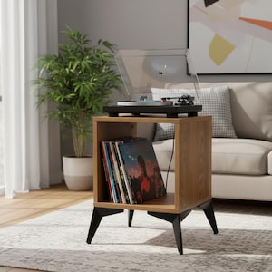Small-space wooden vinyl stand pairing a turntable surface with compact LP storage in a minimalist form.