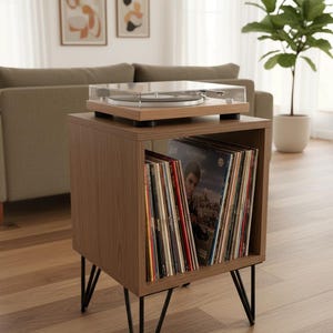 Small-space wooden vinyl stand pairing a turntable surface with compact LP storage in a minimalist form.