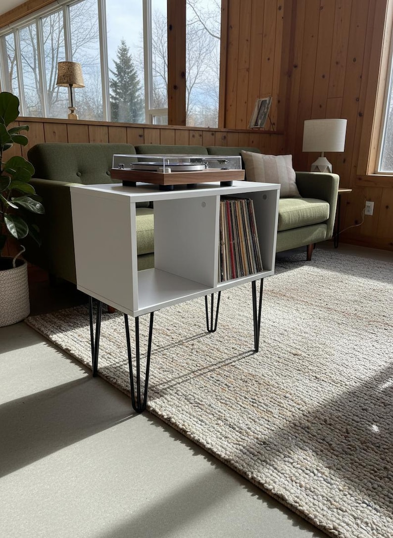 Small-space wooden vinyl stand pairing a turntable surface with compact LP storage in a minimalist form.