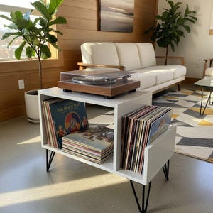 Small-space wooden vinyl stand pairing a turntable surface with compact LP storage in a minimalist form.