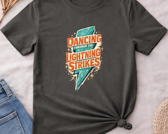 Dancing Through The Lightning Strikes Shirt, Inspirational Lightning Bolt Graphic Tee, Vintage Retro Storm Quote T-Shirt, Music Fan Gift