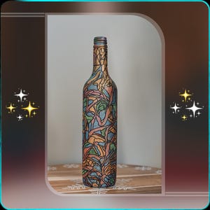 May include: A decorative wine bottle with a colourful stained-glass design. The bottle features a pattern of blue, green, orange, and brown shapes. The bottle is displayed on a wooden surface.