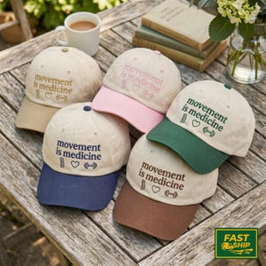 Embroidered Movement is Medicine Trucker Hat