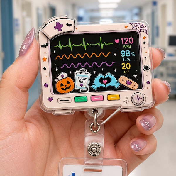 May include: A rectangular badge reel featuring a medical monitor graphic with a heart rate display, SpO2, and RR readings. The frame is decorated with Halloween motifs like a pumpkin, spiderweb, and bandage. Below hangs a City Hospital ID badge.